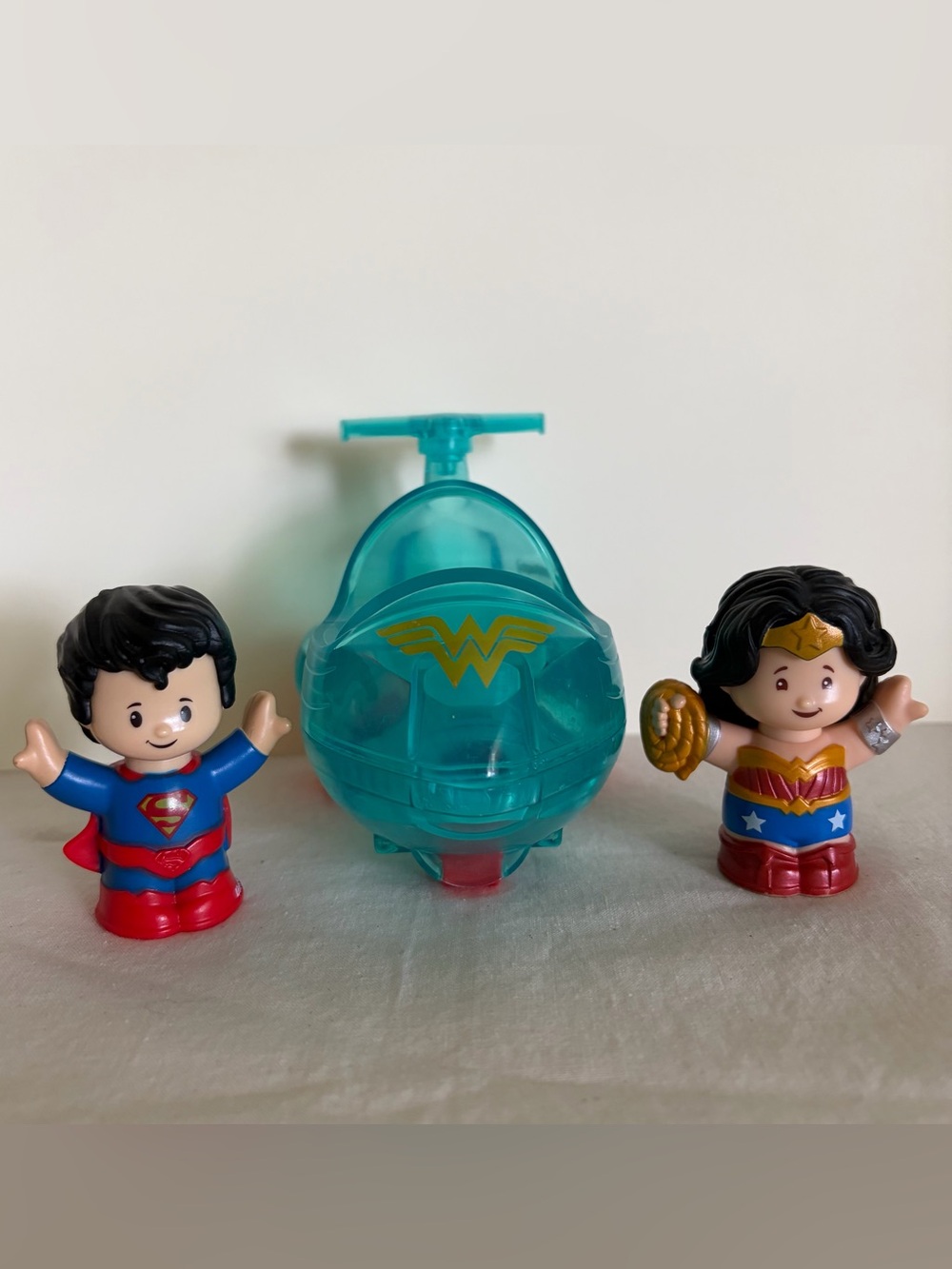 Fisher-Price Little People, DC’s Superman, Wonder Woman, and Invisible Jet toys